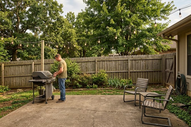 New concrete patio with outdoor furniture in a backyard